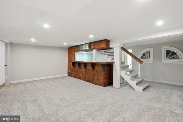 a kitchen with sink and cabinets