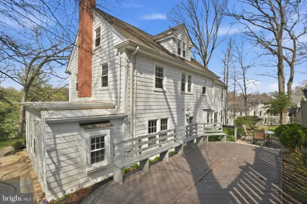 a view of a backyard with sitting area