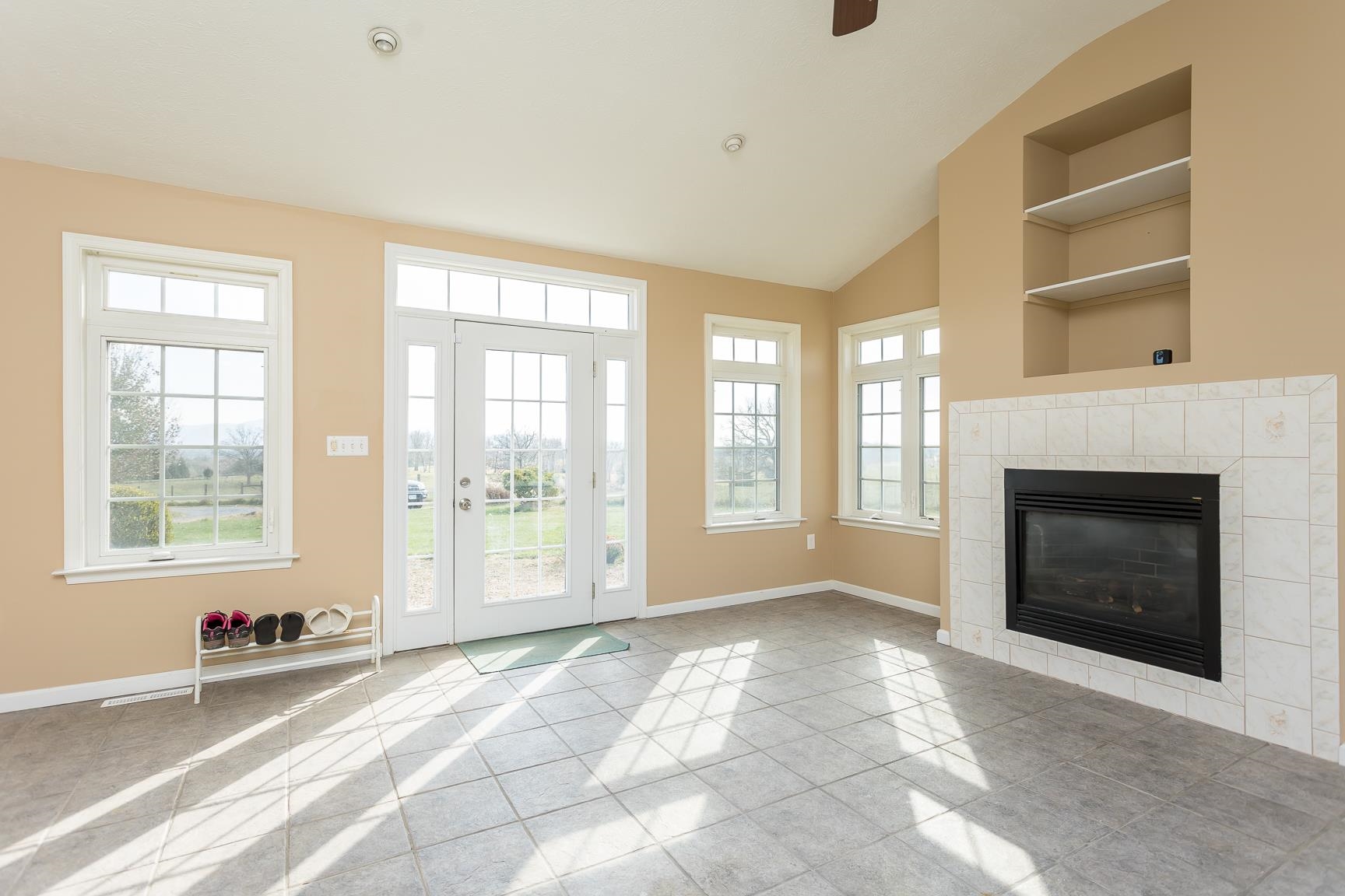 5482 Williams Run Road Mount Crawford, VA 22841 - Photo 15 of 46 a view of an empty room with a fireplace and a window