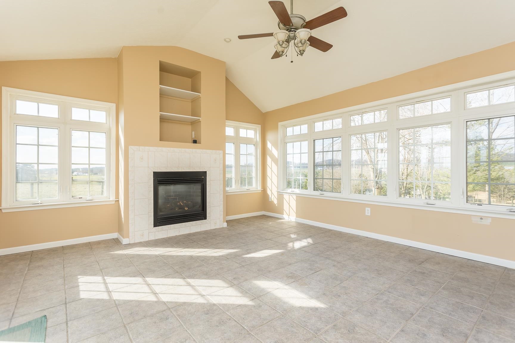 5482 Williams Run Road Mount Crawford, VA 22841 - Photo 16 of 46 a view of an empty room with a fireplace and a window