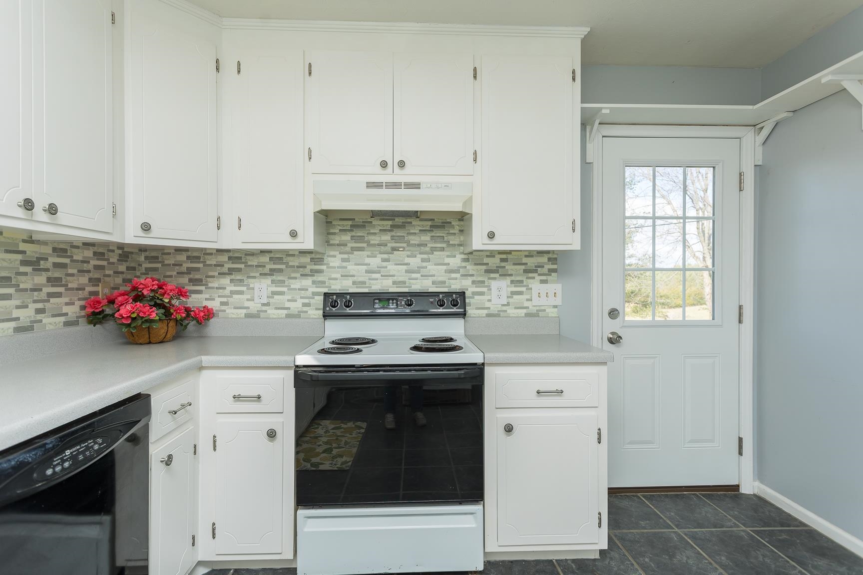 5482 Williams Run Road Mount Crawford, VA 22841 - Photo 20 of 46 a kitchen with granite countertop white cabinets and white appliances