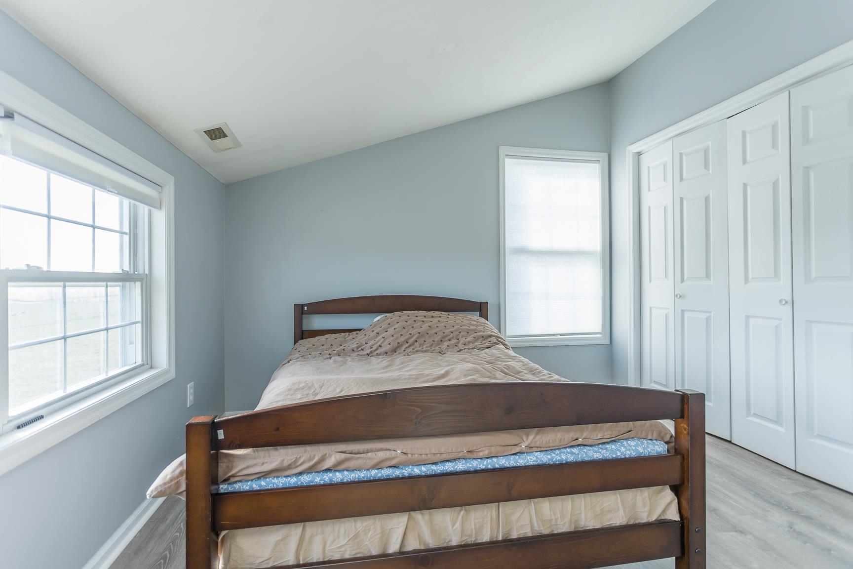 5482 Williams Run Road Mount Crawford, VA 22841 - Photo 30 of 46 a large bed sitting in a bedroom next to a window