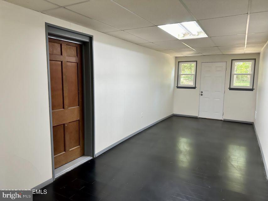 135 South Main Street Barnegat, NJ 08005 - Photo 17 of 35 an empty room with wooden floor and windows