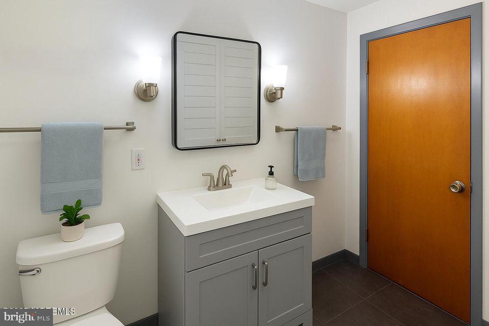 135 South Main Street Barnegat, NJ 08005 - Photo 28 of 35 a bathroom with a sink toilet and mirror