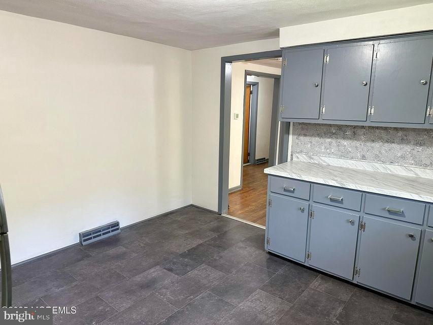 135 South Main Street Barnegat, NJ 08005 - Photo 8 of 35 a kitchen with granite countertop cabinets and sink