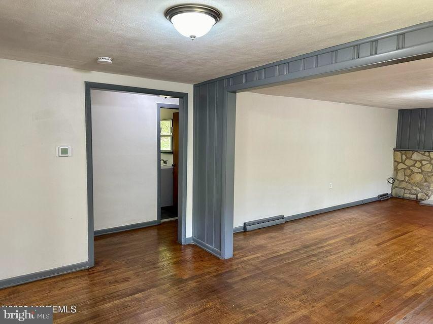 135 South Main Street Barnegat, NJ 08005 - Photo 9 of 35 an empty room with wooden floor and closet