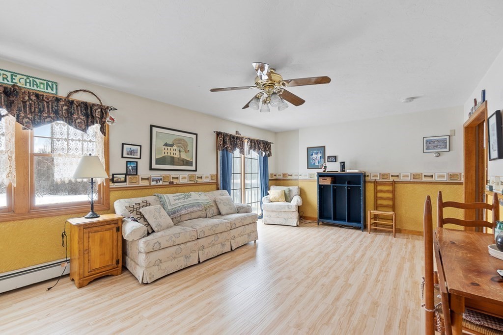 164 Sterling Road Princeton, MA 01541 - Photo 15 of 36 a living room with furniture and a large window