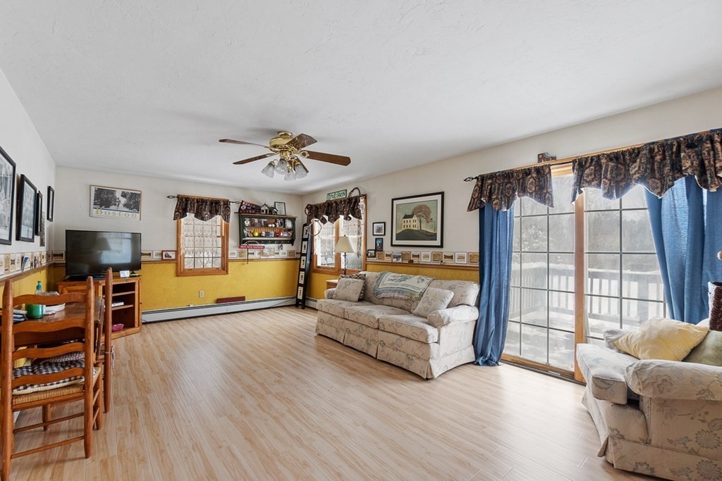 164 Sterling Road Princeton, MA 01541 - Photo 16 of 36 a living room with furniture and a large window