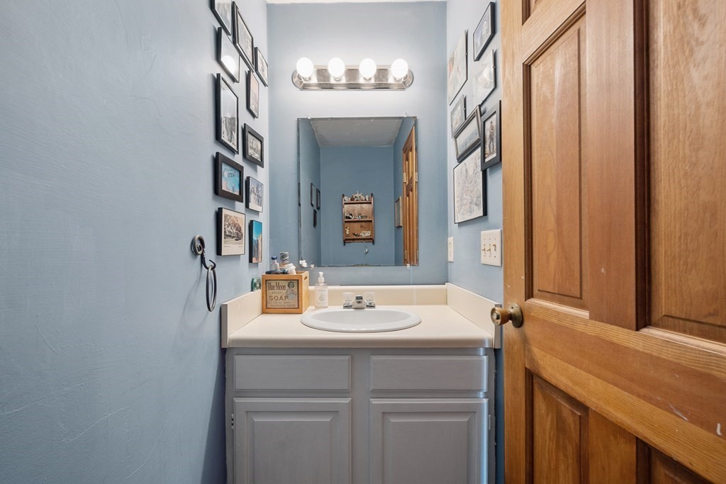 164 Sterling Road Princeton, MA 01541 - Photo 17 of 36 a bathroom with a sink and a mirror