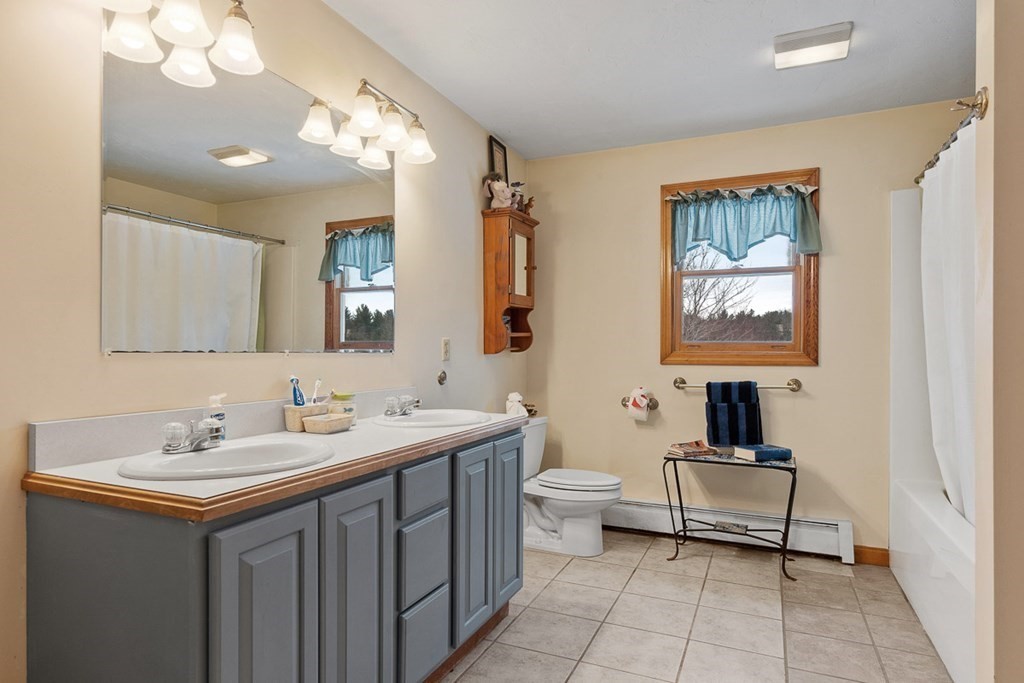 164 Sterling Road Princeton, MA 01541 - Photo 21 of 36 a bathroom with a sink and a mirror