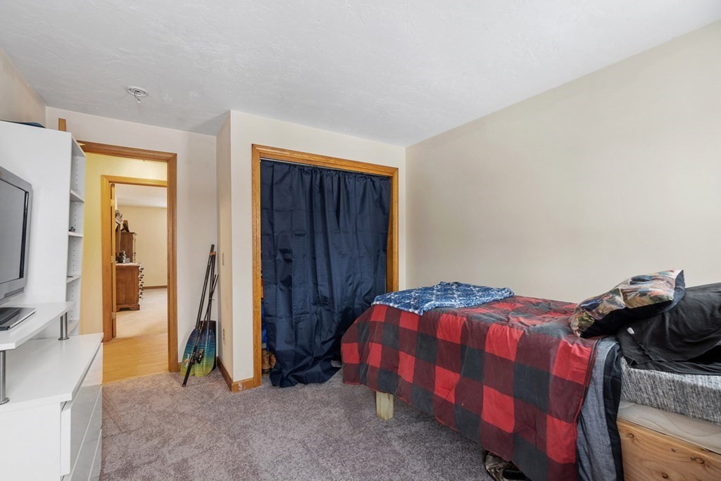 164 Sterling Road Princeton, MA 01541 - Photo 28 of 36 a bedroom with a bed and a closet