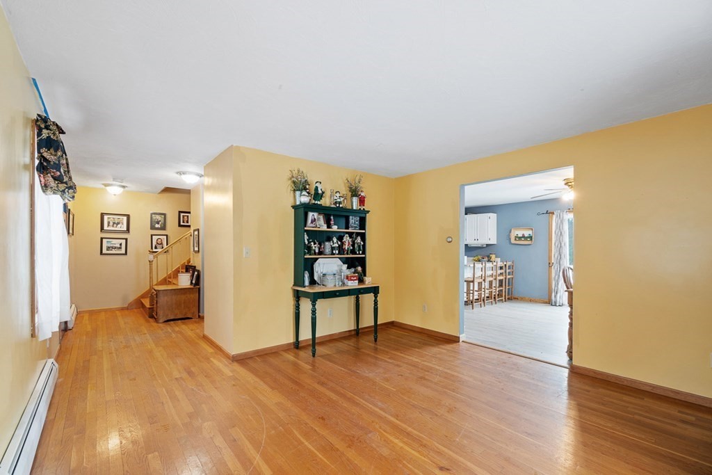 164 Sterling Road Princeton, MA 01541 - Photo 7 of 36 a living room with furniture and wooden floor