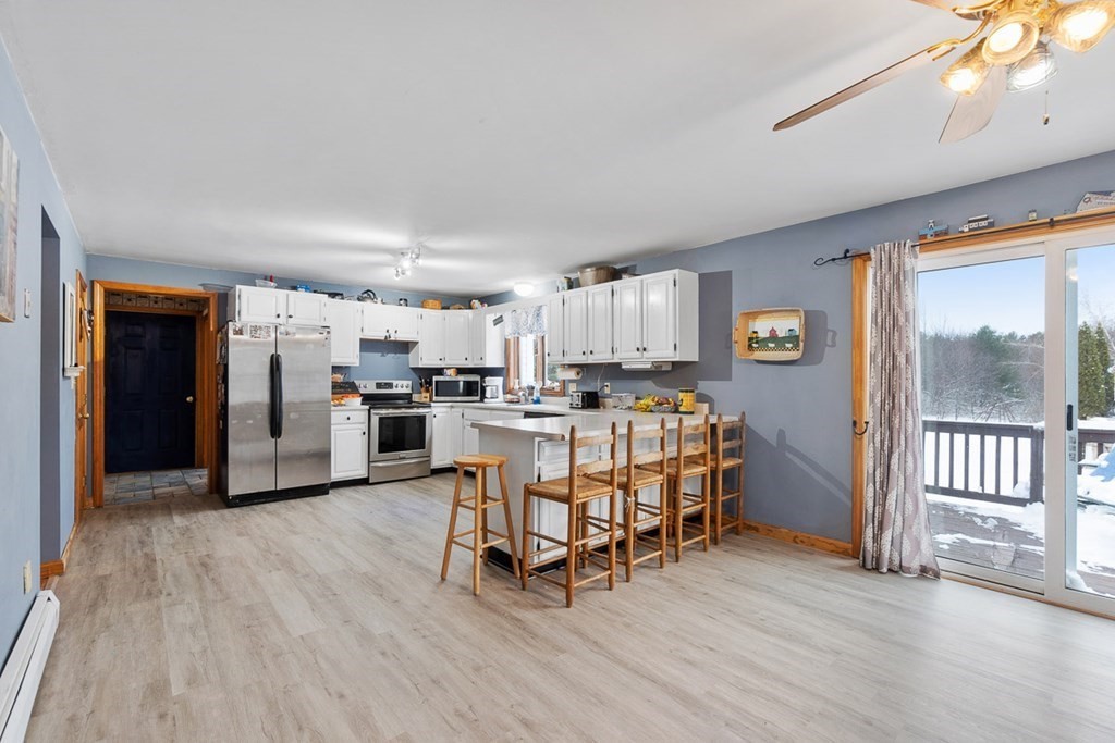 164 Sterling Road Princeton, MA 01541 - Photo 10 of 36 a living room with furniture and kitchen view