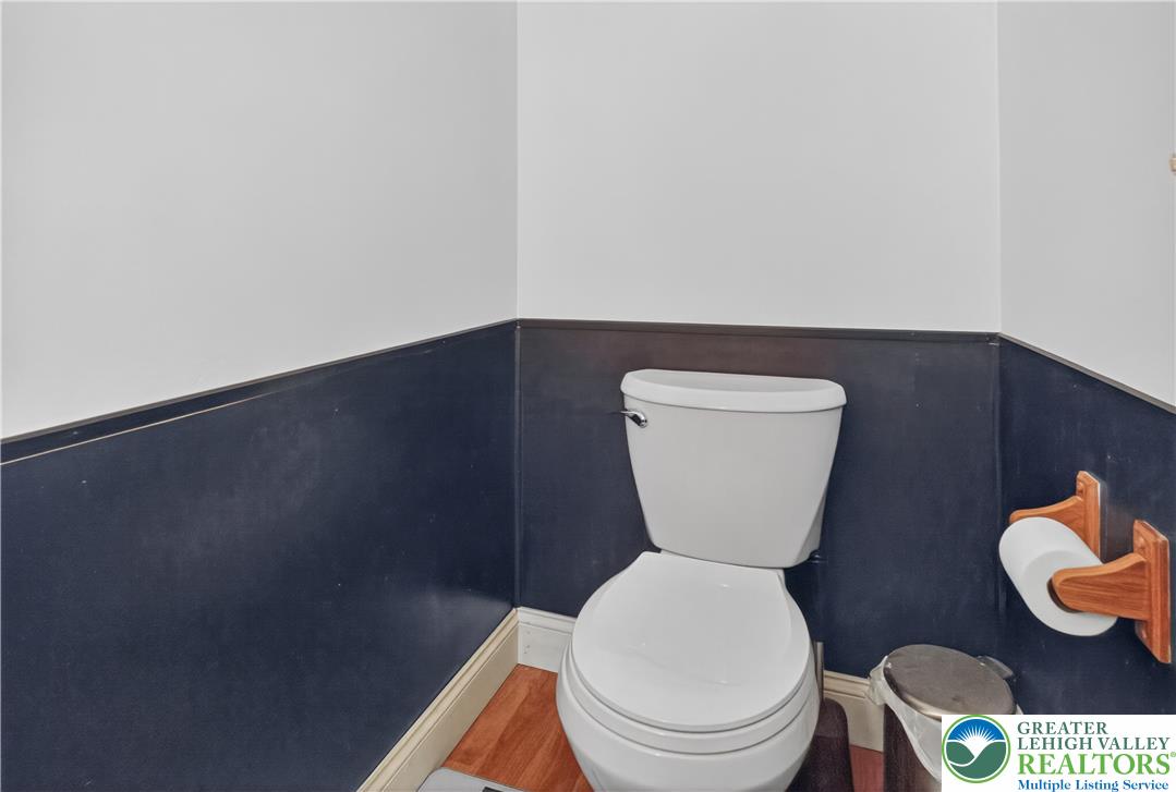 479 South 9th Street Akron, PA 17501 - Photo 13 of 33 A well-appointed powder room features rich wall paneling and gleaming wood floors.