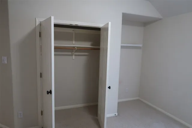 a bathroom with a sink mirror and a shower