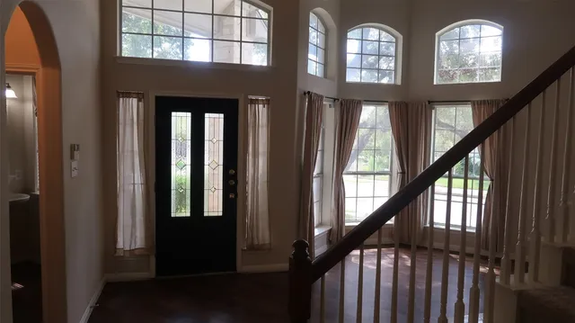 a view of a kitchen with a sink and chandelier