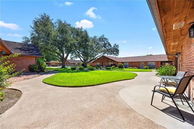 a view of a swimming pool in a backyard