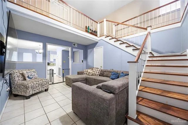 a living room with furniture and a rug