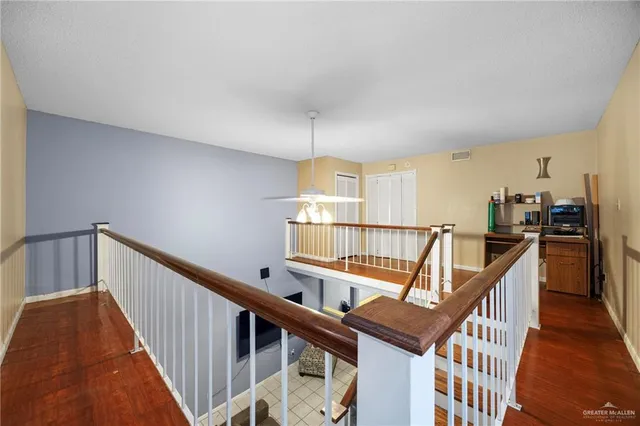 a view of entryway with wooden floor and windows