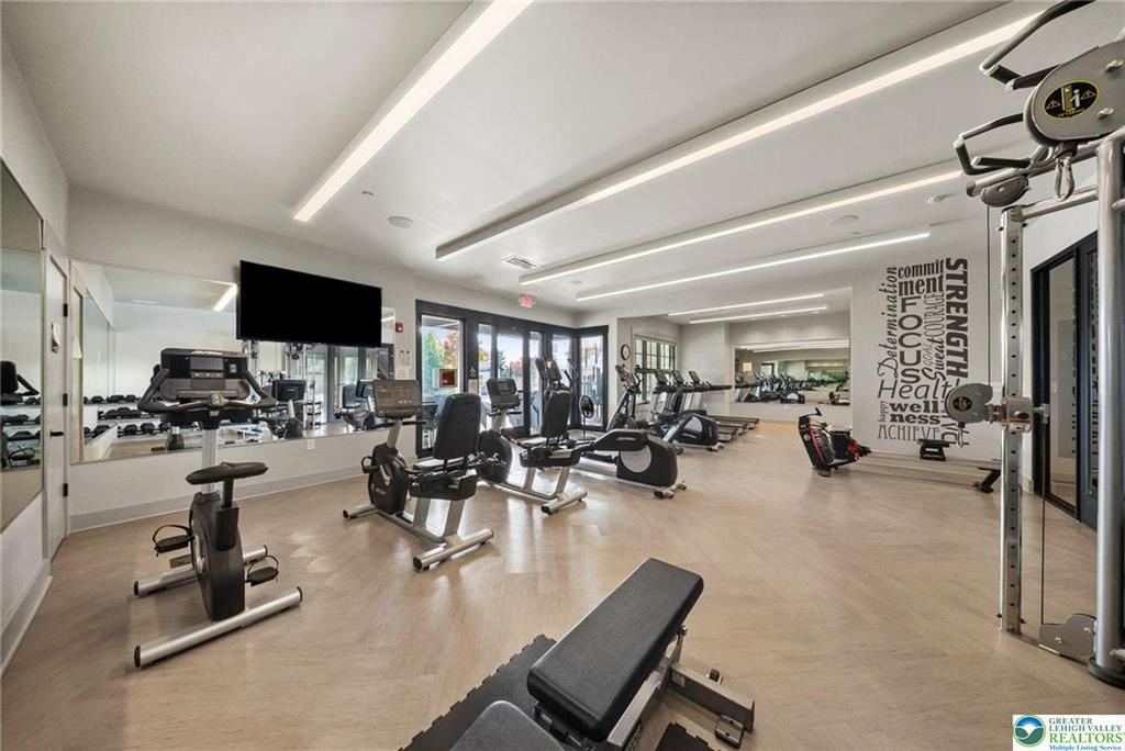 4097 Rutz Lane Allentown, PA 18104 - Photo 54 of 59 Linear lighting and herringbone-patterned flooring define this modern fitness facility.