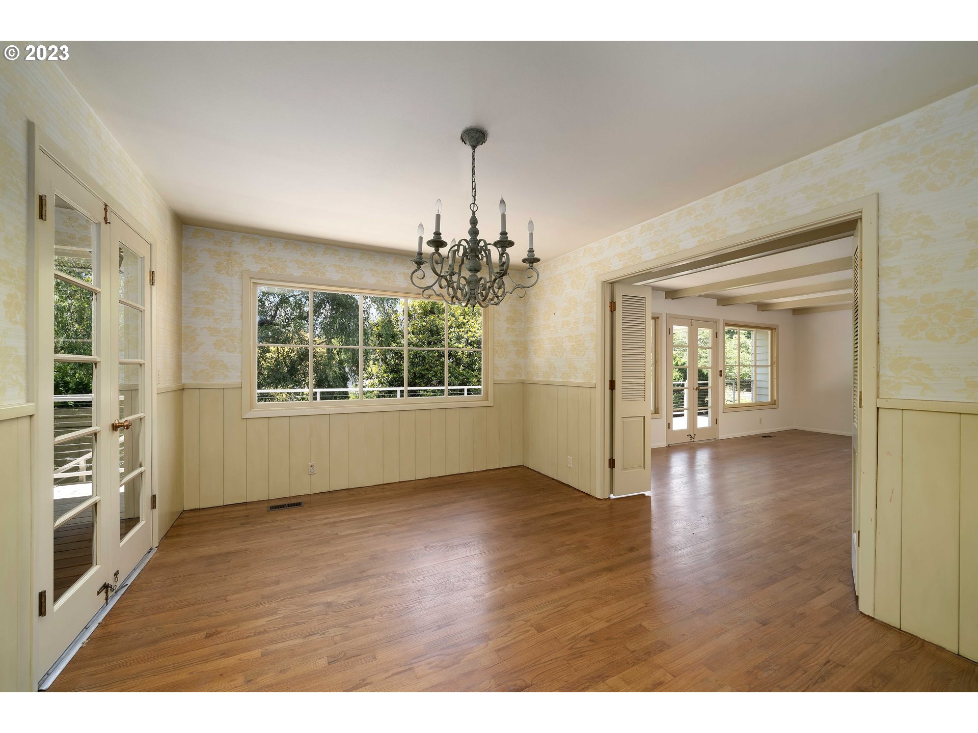 3815 Southwest 50th Avenue Portland, OR 97221 - Photo 11 of 36 a view of an empty room with window and wooden floor