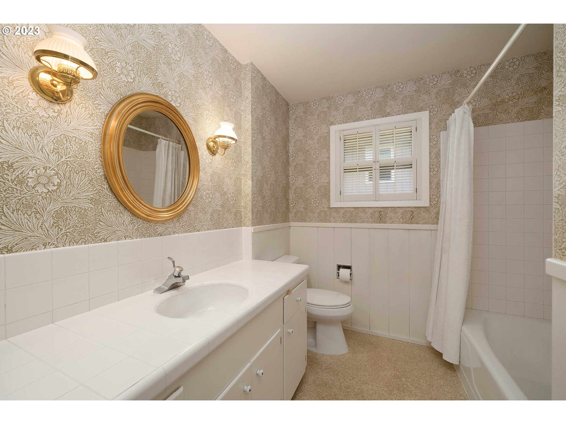 3815 Southwest 50th Avenue Portland, OR 97221 - Photo 16 of 36 a bathroom with a sink and a mirror