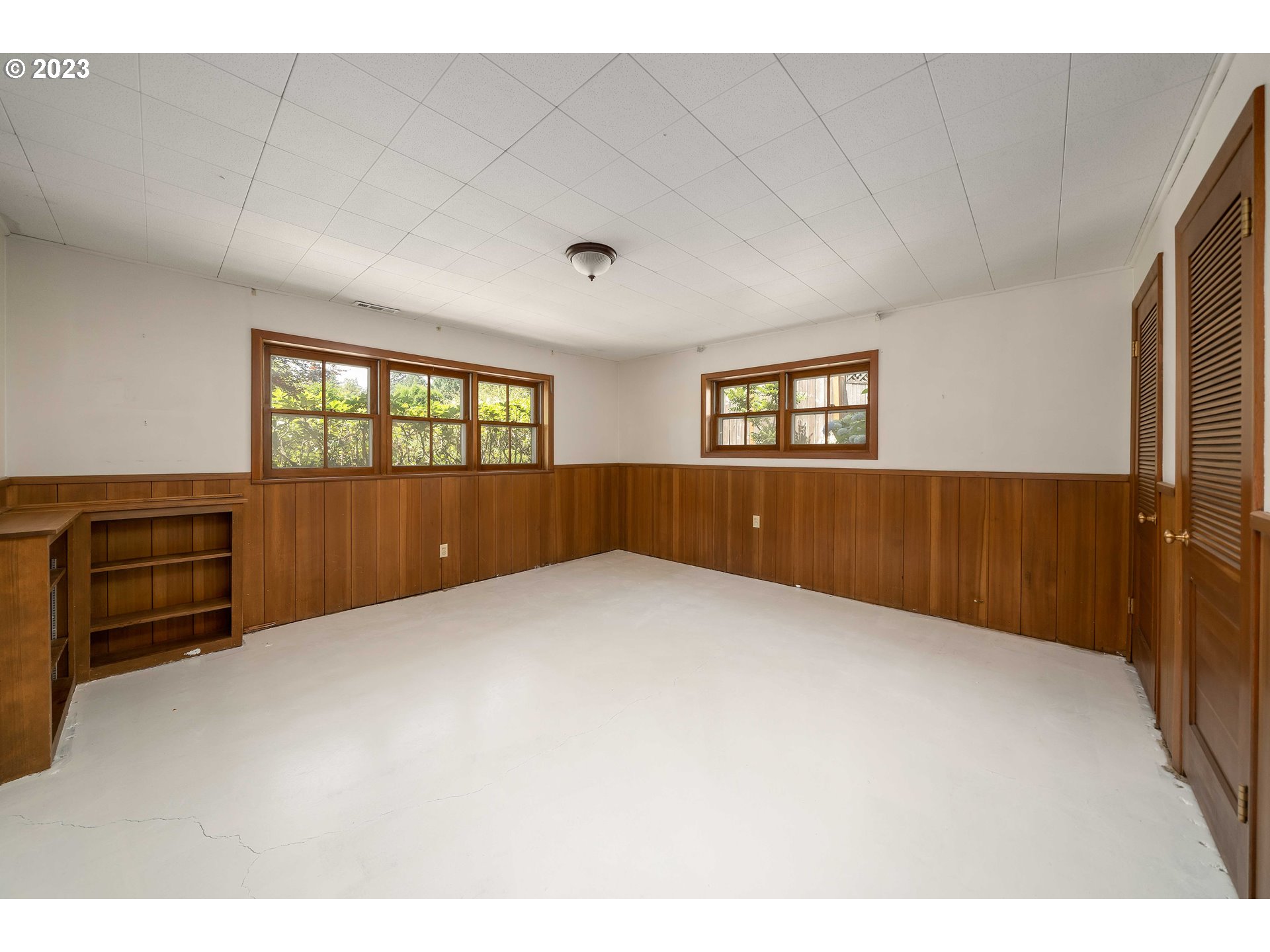 3815 Southwest 50th Avenue Portland, OR 97221 - Photo 20 of 36 a view of an empty room with wooden floor and windows