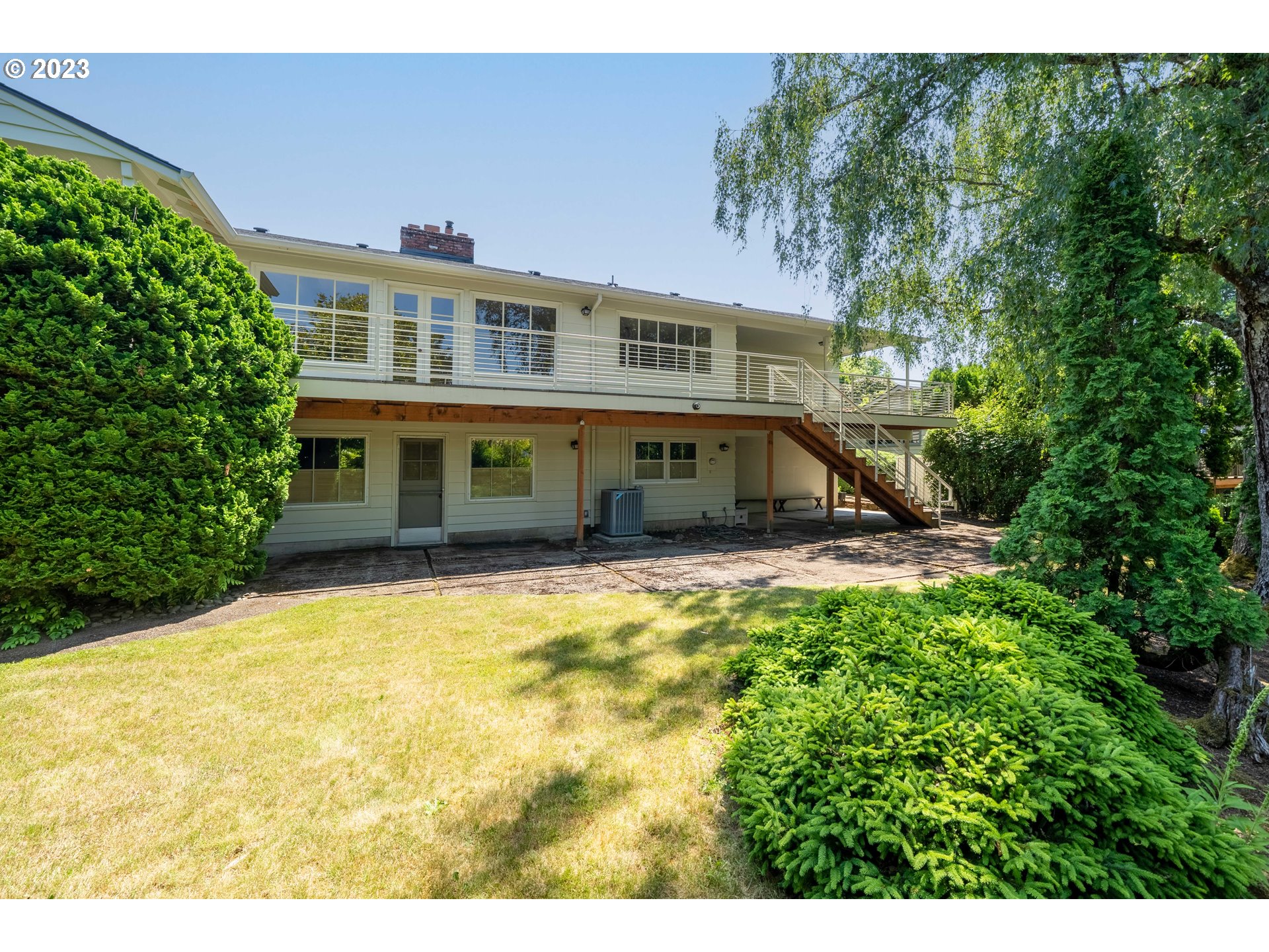 3815 Southwest 50th Avenue Portland, OR 97221 - Photo 31 of 36 a front view of a house with a yard