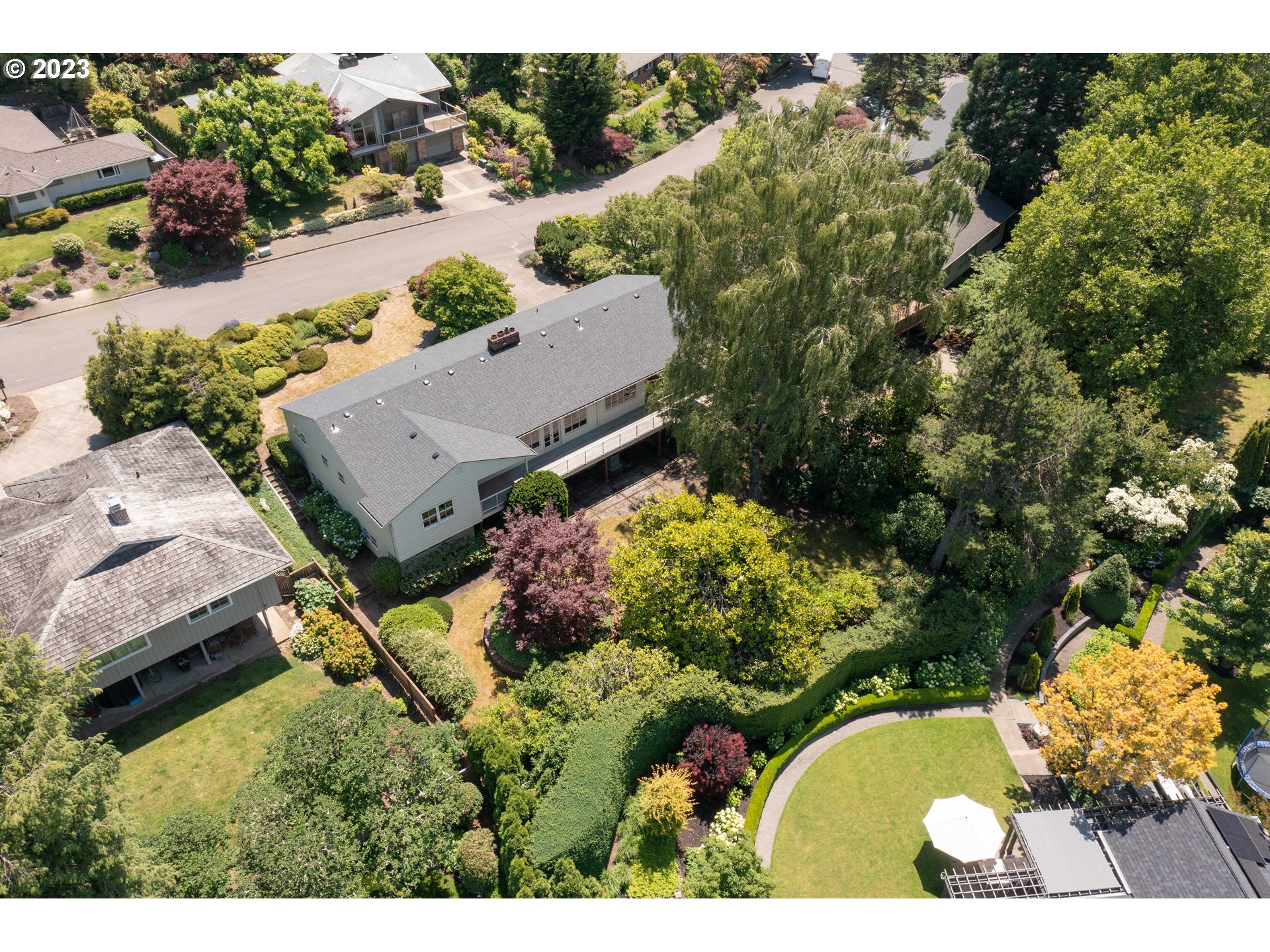 3815 Southwest 50th Avenue Portland, OR 97221 - Photo 34 of 36 an aerial view of a house with a yard swimming pool and outdoor seating