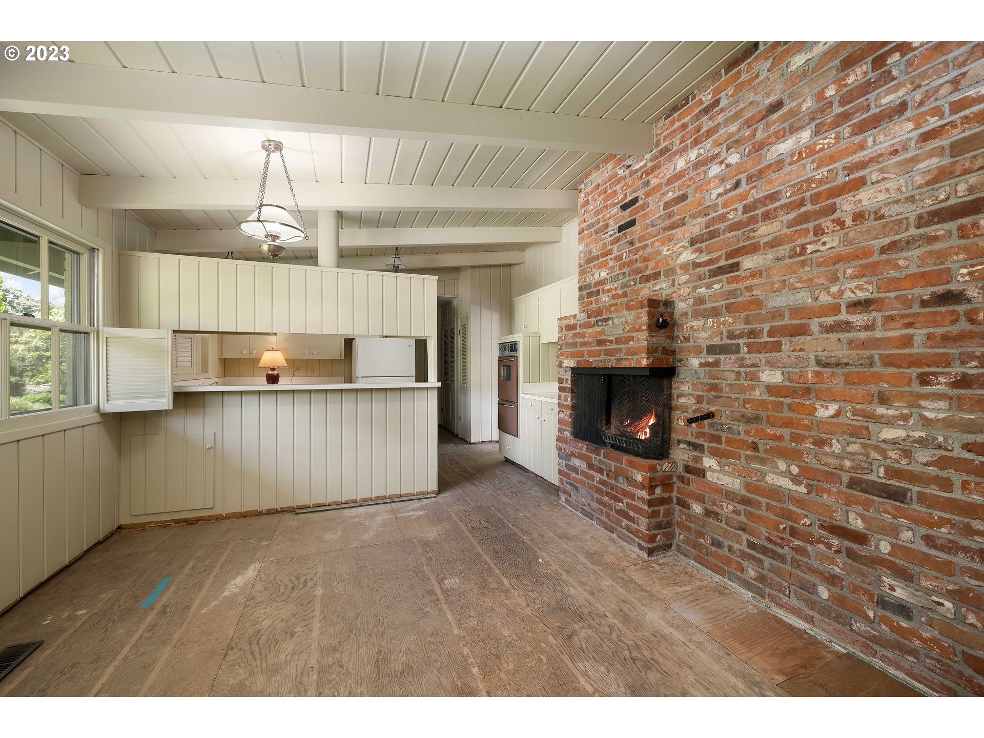 3815 Southwest 50th Avenue Portland, OR 97221 - Photo 5 of 36 a view of kitchen with furniture and fireplace