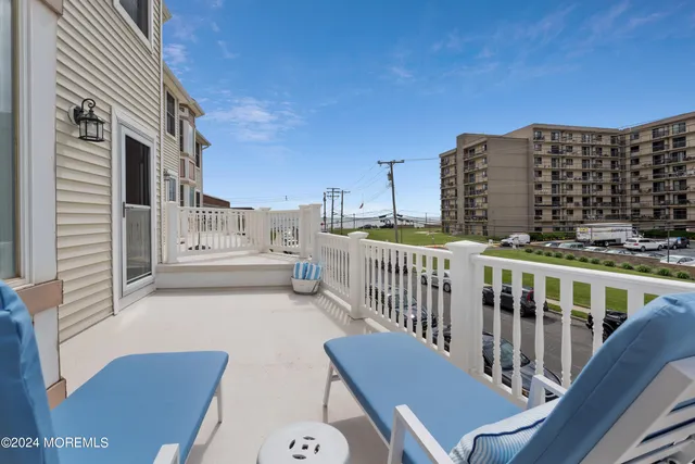 a view of balcony with furniture