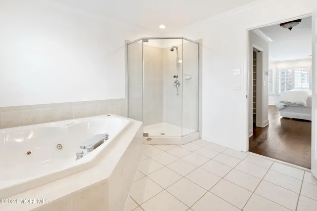 a bathroom with a tub shower and sink