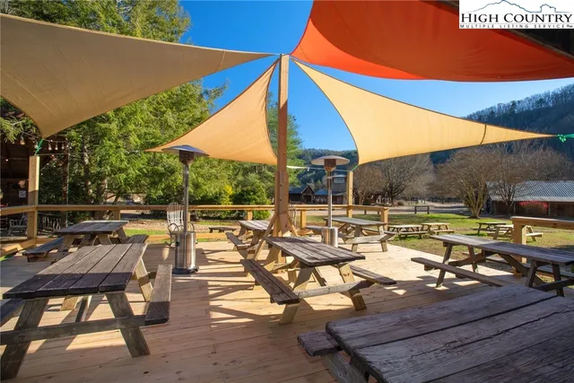 a view of swimming pool with outdoor seating and plants