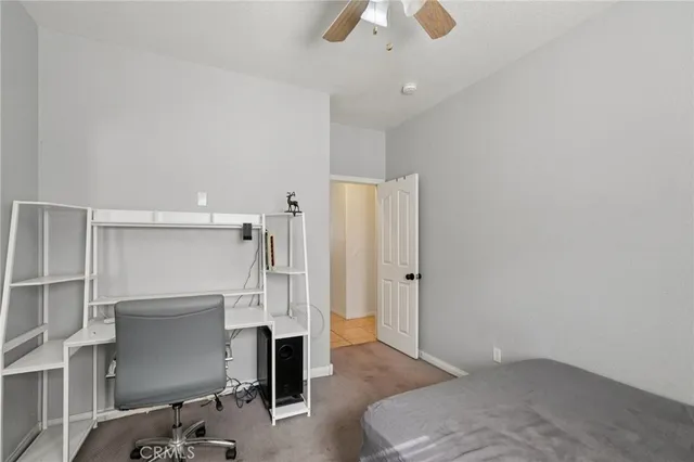 a view of livingroom with hardwood floor and a ceiling fan