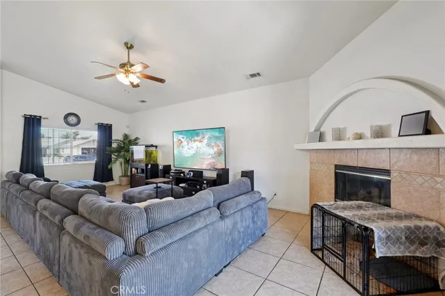 a living room with furniture and a fireplace