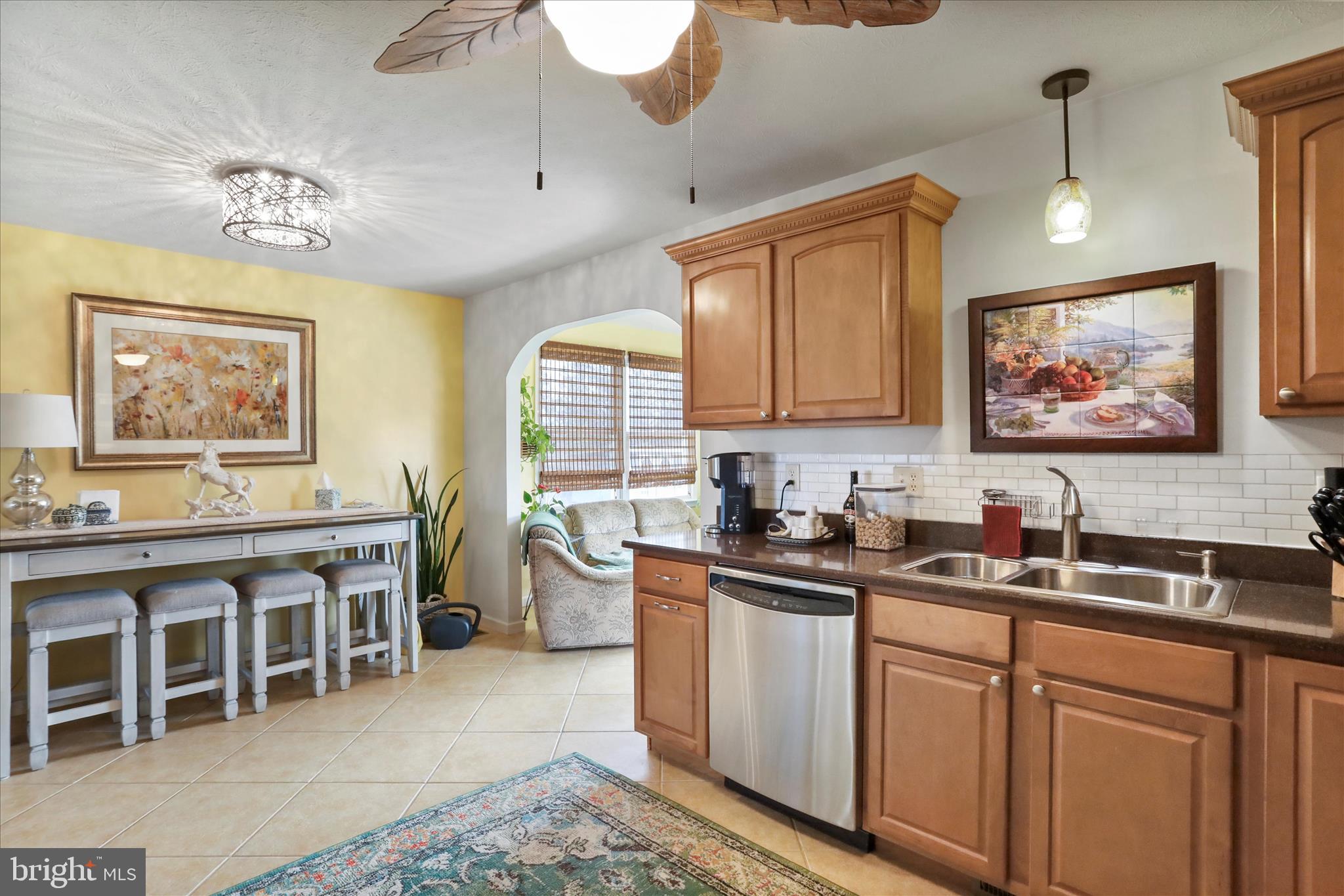 5670 Long Meadow Road Middletown, VA 22645 - Photo 11 of 61 a kitchen with a sink stove and cabinets