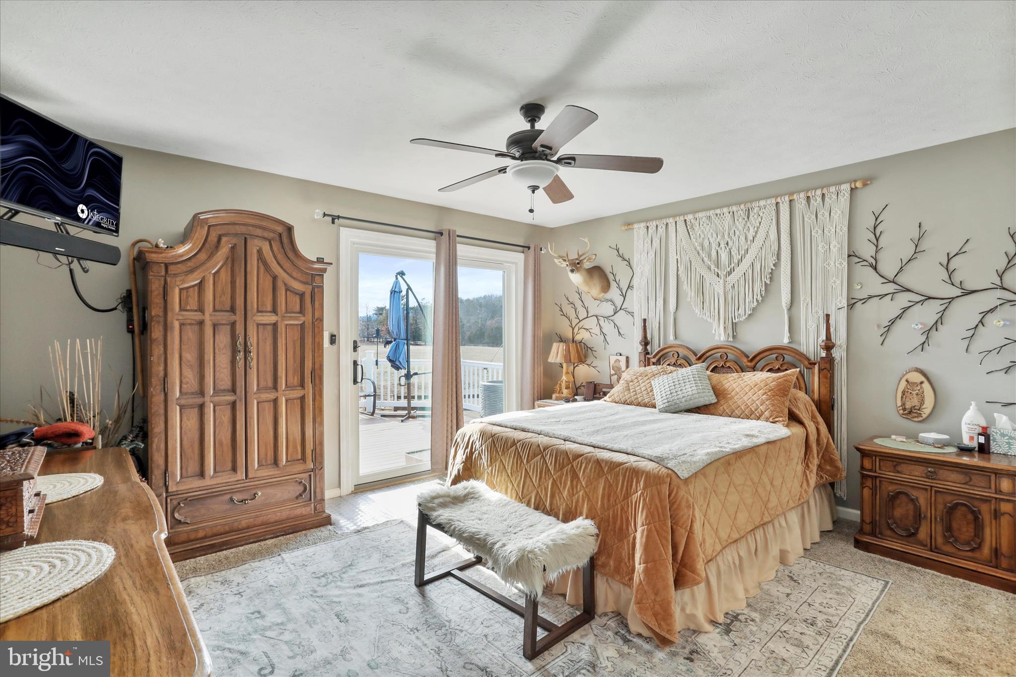 5670 Long Meadow Road Middletown, VA 22645 - Photo 12 of 61 a bedroom with a bed and a chandelier