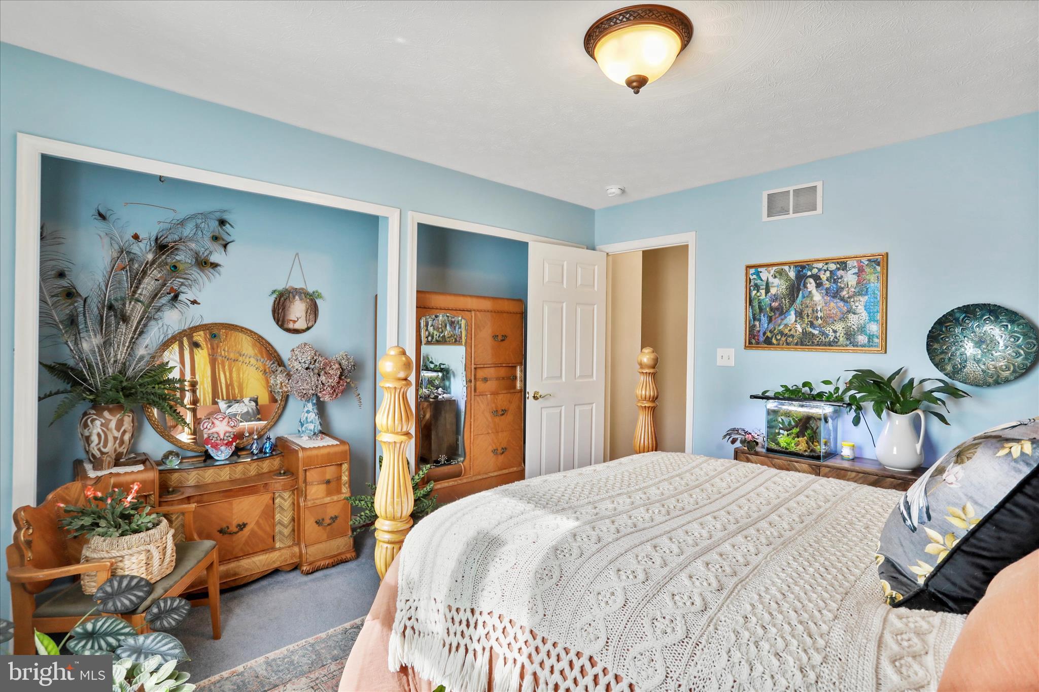 5670 Long Meadow Road Middletown, VA 22645 - Photo 21 of 61 a bedroom with bed and a mirror