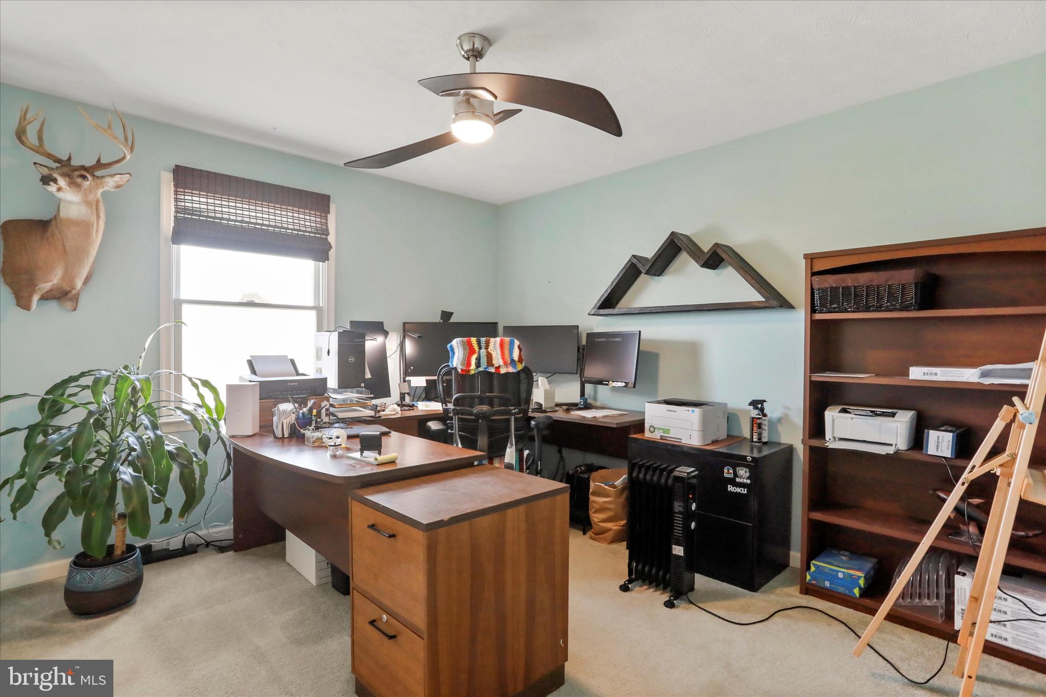 5670 Long Meadow Road Middletown, VA 22645 - Photo 24 of 61 a view of a workspace with furniture and a window