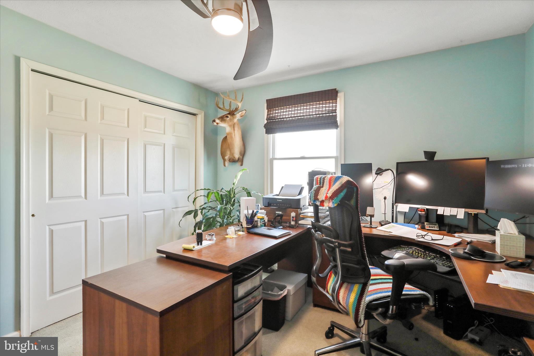 5670 Long Meadow Road Middletown, VA 22645 - Photo 25 of 61 a view of a workspace with furniture and a window