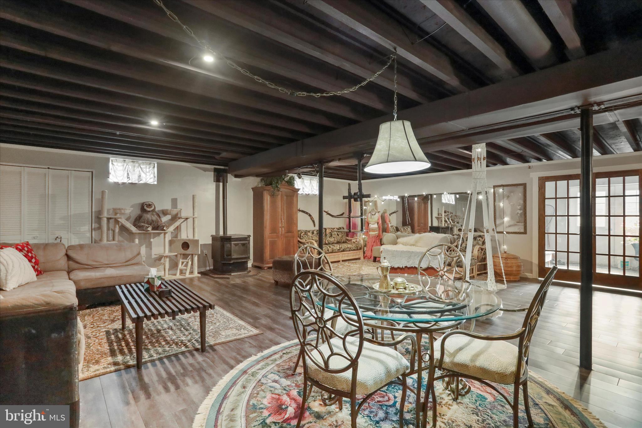 5670 Long Meadow Road Middletown, VA 22645 - Photo 31 of 61 a dining room with furniture wooden floor and a chandelier