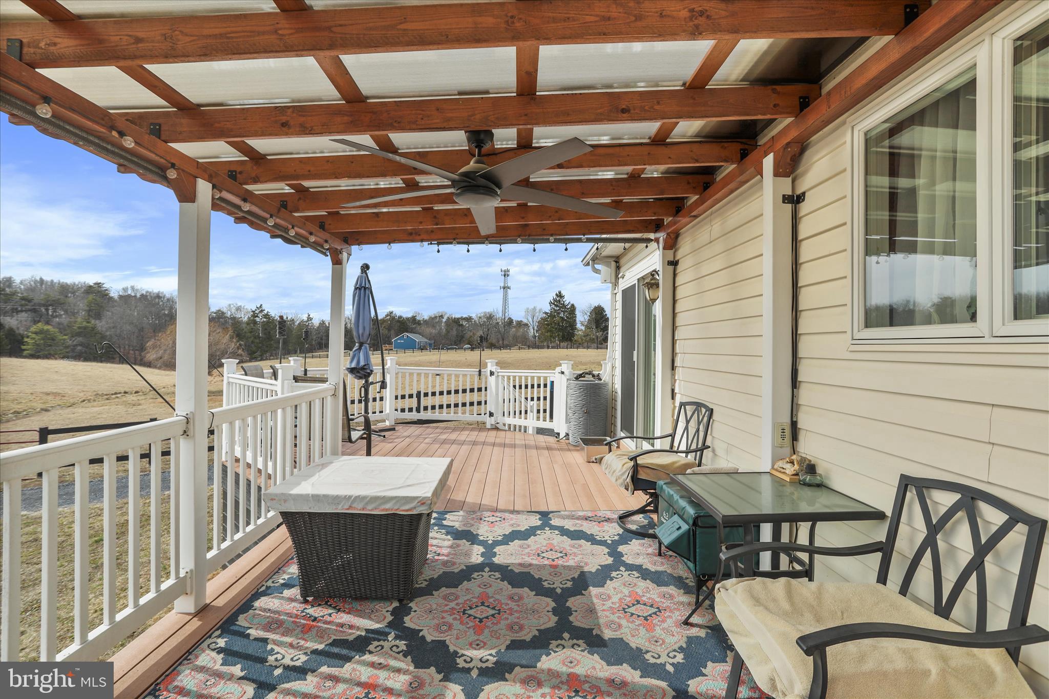5670 Long Meadow Road Middletown, VA 22645 - Photo 40 of 61 a roof deck with table and chairs