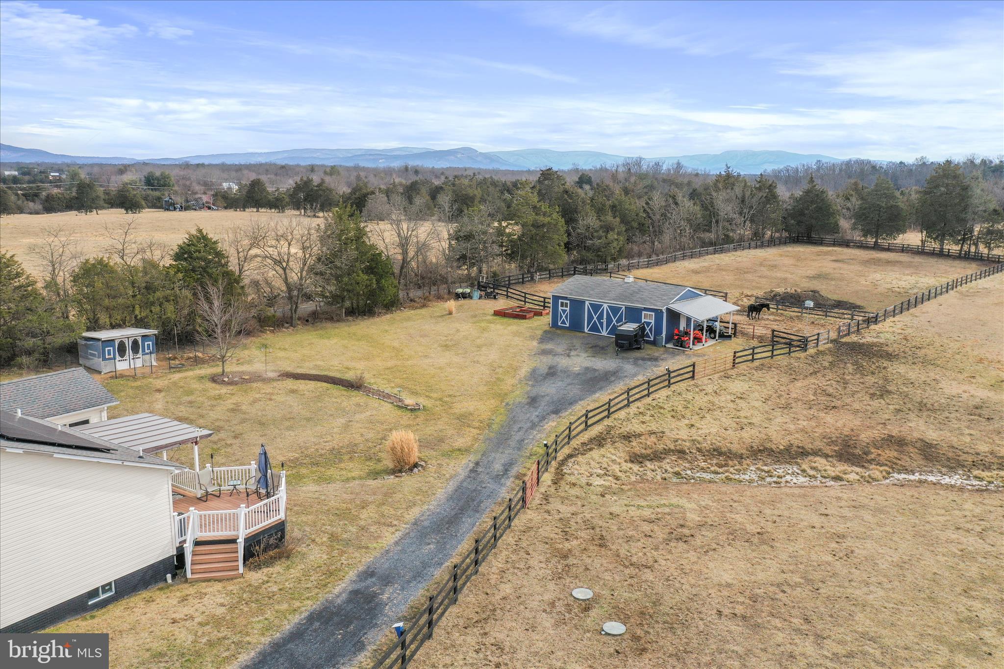 5670 Long Meadow Road Middletown, VA 22645 - Photo 59 of 61 a view of a terrace with wooden floor and mountain view