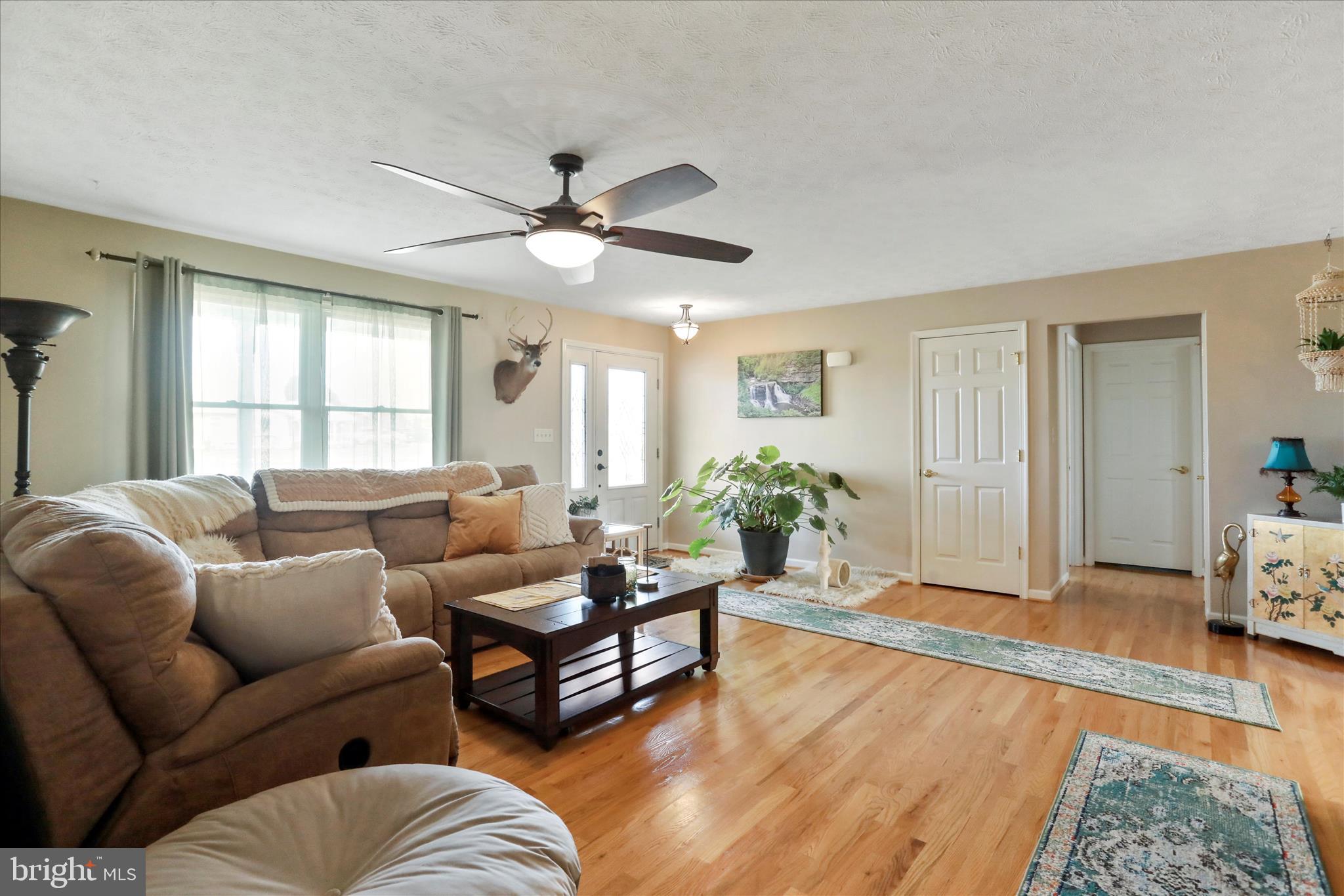 5670 Long Meadow Road Middletown, VA 22645 - Photo 7 of 61 a living room with furniture and a large window
