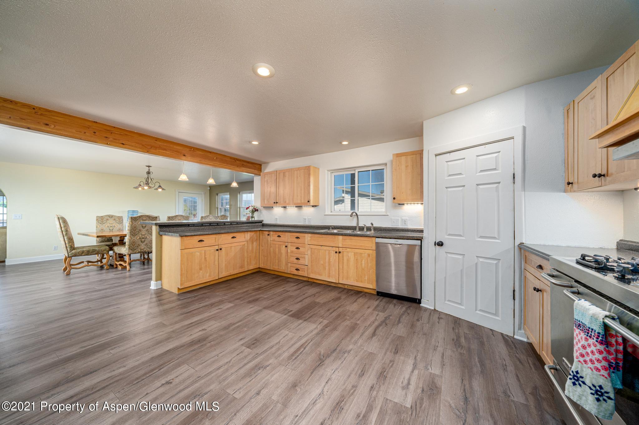 1507 Anvil View Avenue Rifle, CO 81650 - Photo 3 of 37 a large kitchen with a lot of counter space and wooden floor