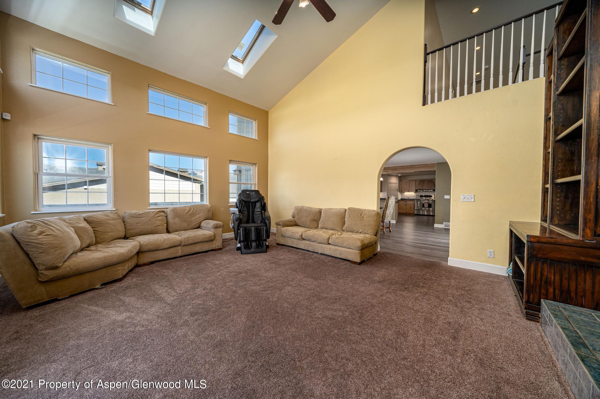 1507 Anvil View Avenue Rifle, CO 81650 - Photo 8 of 37 a living room with furniture and a potted plant