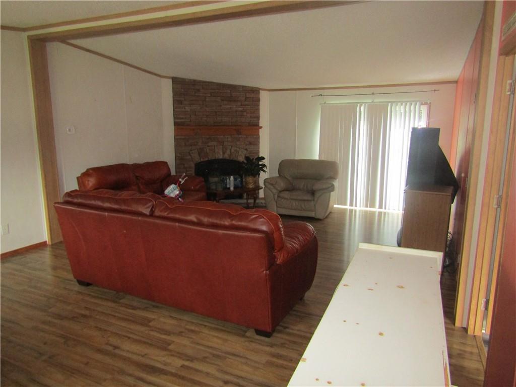 521 Williams Street Confluence, PA 15424 - Photo 3 of 38 a living room with furniture and a fireplace
