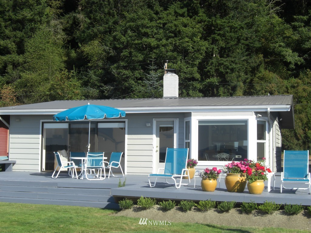 a front view of house with yard outdoor seating and green space