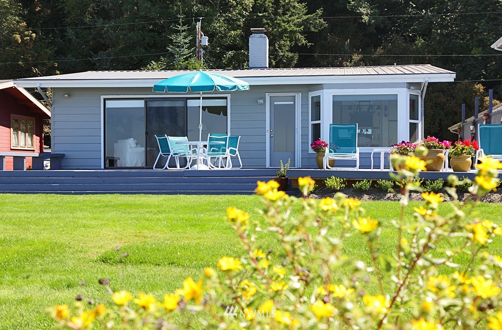 6316 South Bay Road Freeland, WA 98249 - Photo 3 of 15 a front view of house with outdoor seating