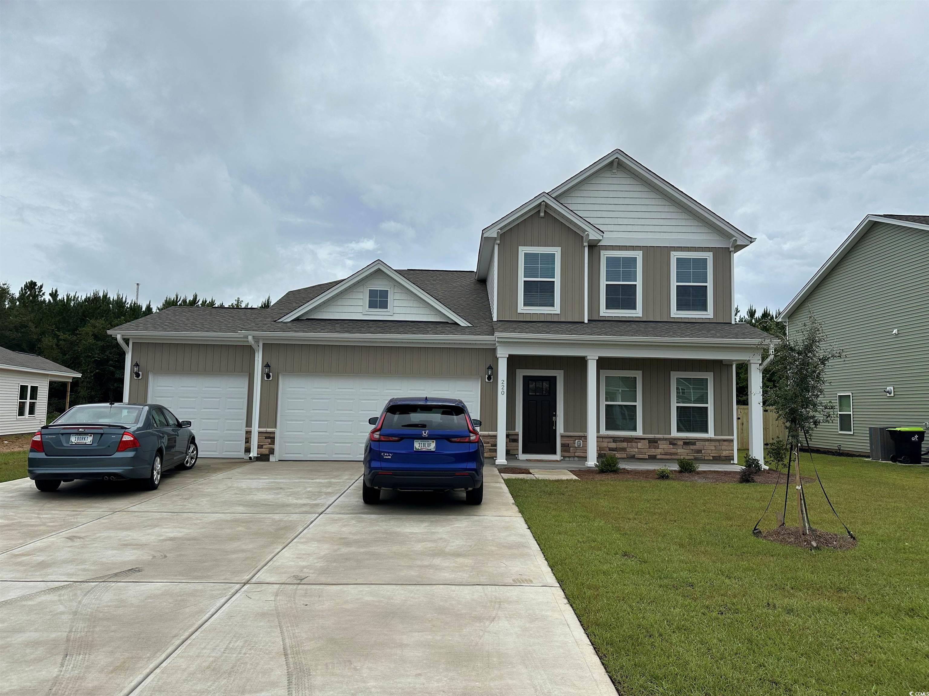 220 Sundrop Way Conway, SC 29526 - Photo 1 of 32 View of front of property featuring driveway, ston
